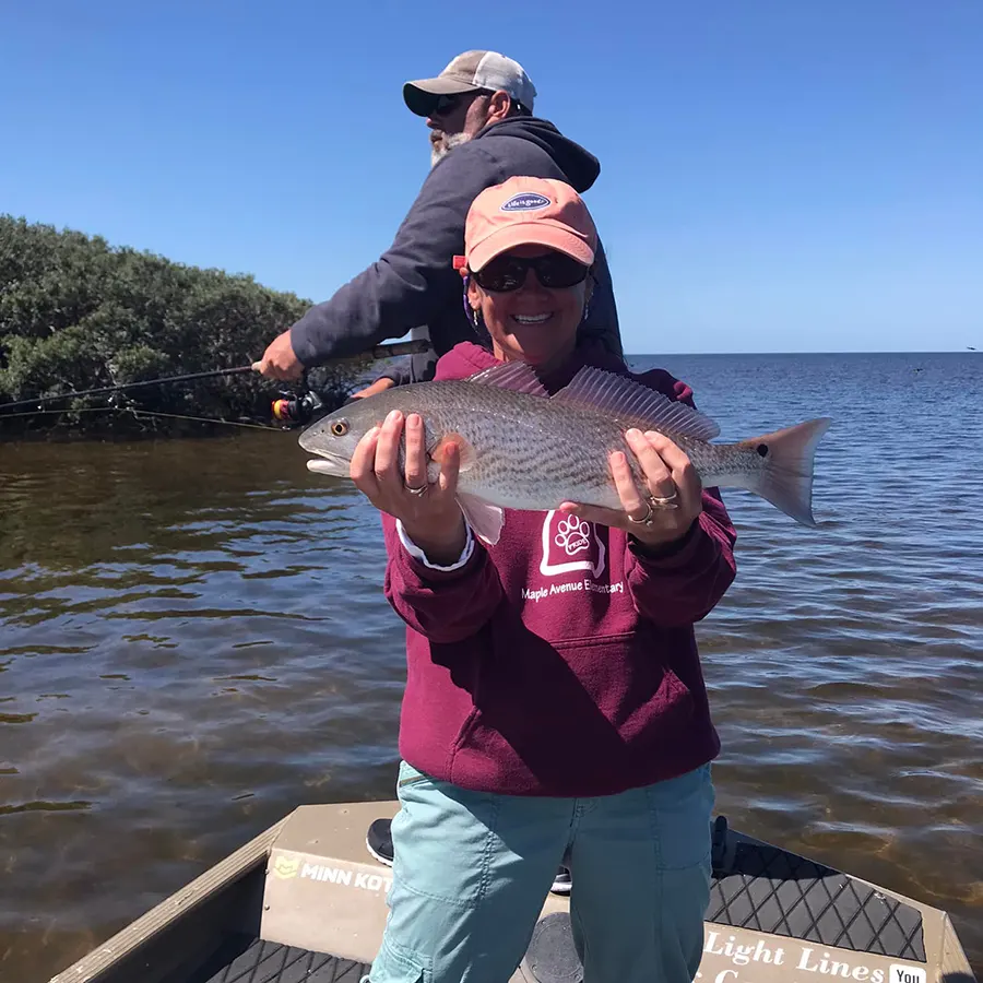 Linda Marcoux Holding Red Drum- Fishing Review