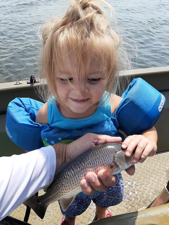 Little Girl holding Grey Mangrove Snapper
