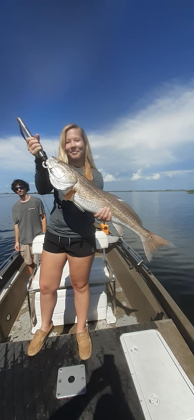 Girl holding large redfish