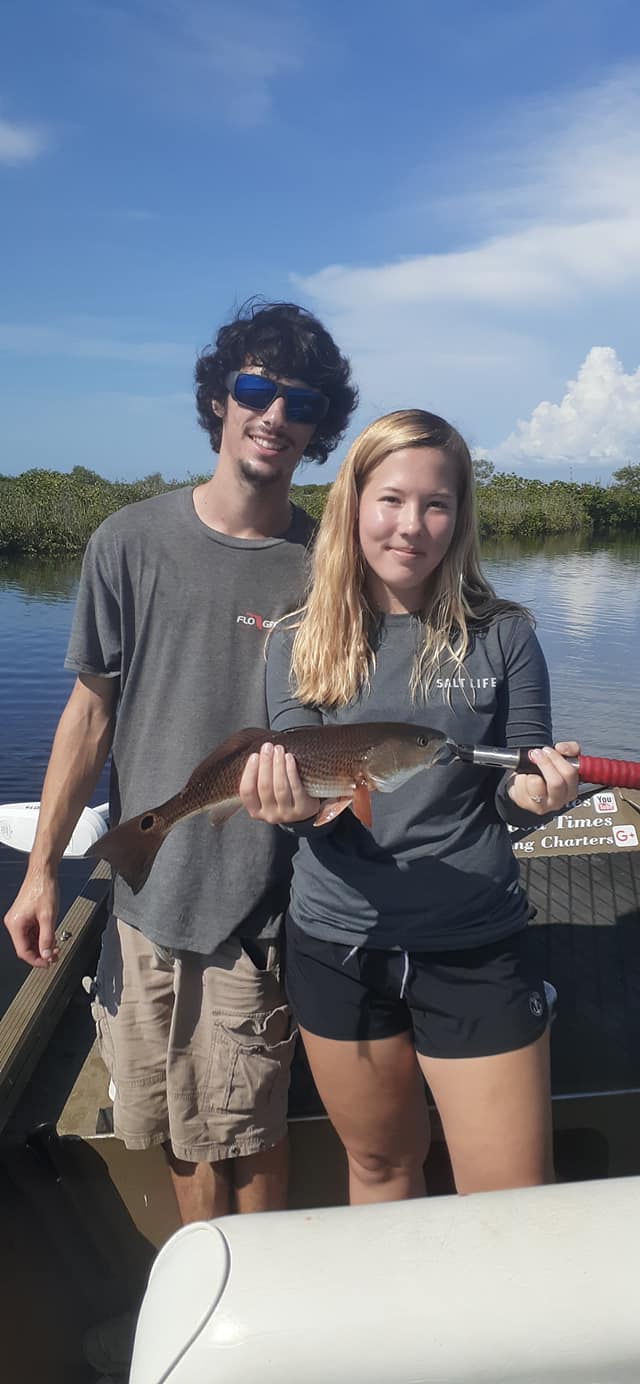 Couple posing with young redfish